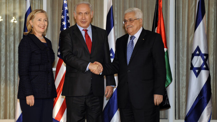 JERUSALEM, ISRAEL - SEPTEMBER 15:  In this photo provided by the U.S. Department of State, Israeli Prime Minister Benjamin Netanyahu (C) shakes hands with Palestinian President Mahmoud Abbas (R) as U.S. Secretary of State Hillary Clinton looks on at the Prime Minister's Residence September 15, 2010 in Jerusalem, Israel. Netanyahu and Abbas are deadlocked in peace negotiations over Israeli settlement building.  (Photo by U.S. Department of State via Getty Images)