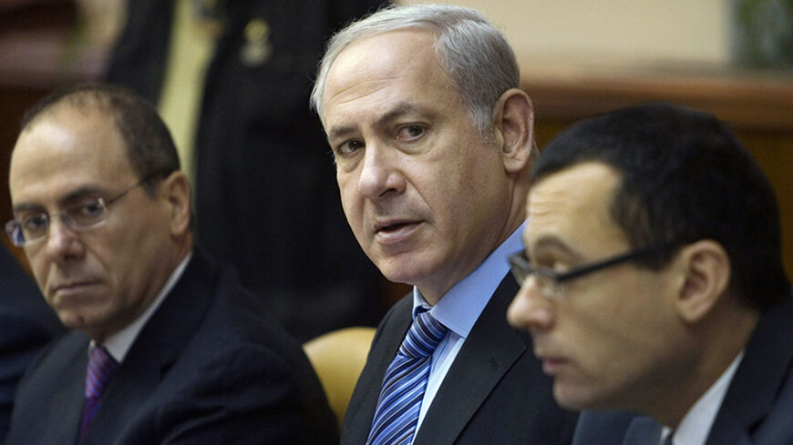 Israel's Prime Minister Benjamin Netanyahu, Vice Prime Minister Silvan Shalom (L) and Cabinet Secretary Zvi Hauser (R) attend the weekly cabinet meeting in Jerusalem June 27, 2010. REUTERS/Dan Balilty/Pool (JERUSALEM - Tags: POLITICS) - RTR2FSS8