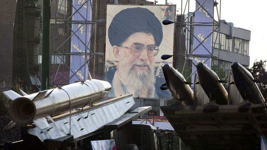 EDITORS' NOTE: Reuters and other foreign media are subject to Iranian restrictions on their ability to film or take pictures in Tehran.
Iranian-made Fateh 110 (Conqueror) (L) and Persian Gulf (R) missiles are seen next to a portrait of Iran's Supreme Leader Ayatollah Ali Khamenei at a war exhibition held by Iran's revolutionary guard to mark the anniversary of the Iran-Iraq war (1980-88), also known in Iran as the "Holy Defence", at Baharestan square near the Iranian Parliament in southern Tehran September 