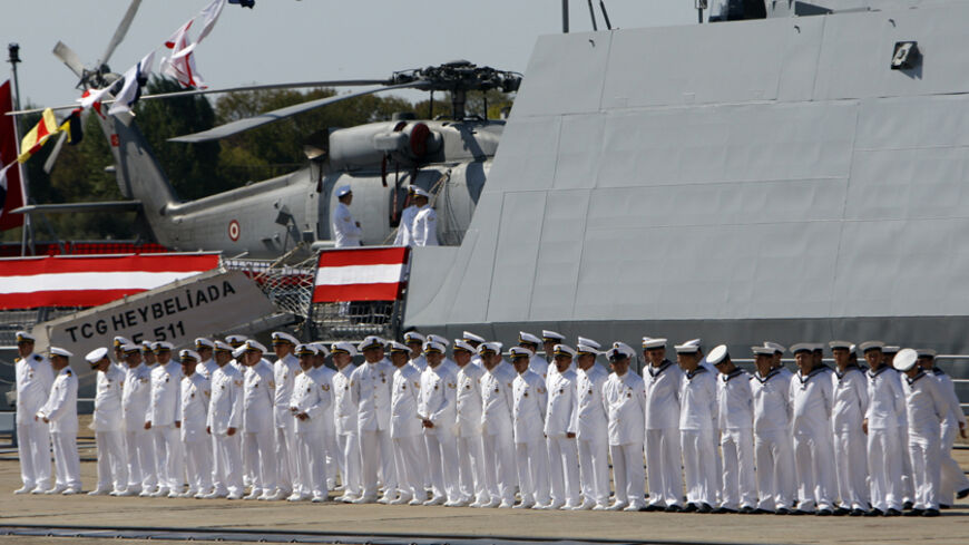 Navy officers attend a delivery ceremony for the first nationally designed combat ship TCG Heybeliada at the Tuzla Naval shipyard in Istanbul September 27, 2011.  REUTERS/Osman Orsal (TURKEY - Tags: POLITICS MILITARY) - RTR2RWMP