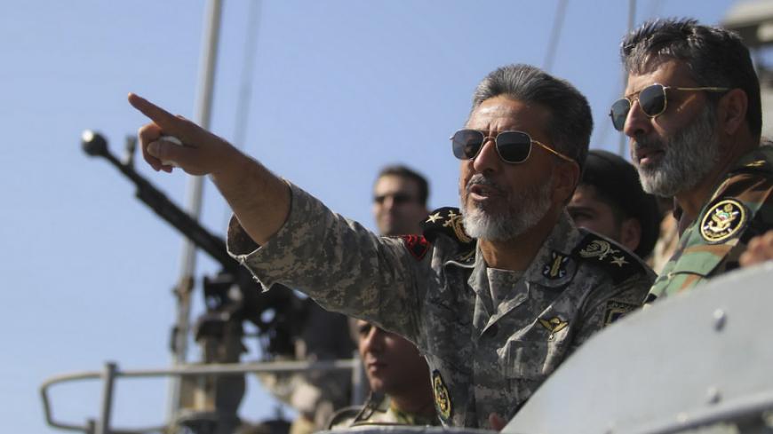 Iran's Navy commander Habibollah Sayyari (C) points while standing on a naval ship during Velayat-90 war game on Sea of Oman near the Strait of Hormuz in southern Iran January 1, 2012. Iran test-fired a new medium-range missile, designed to evade radars, on Sunday during the last days of its naval drill in the Gulf, the official IRNA news agency quoted a military official as saying. REUTERS/Fars News/Hamed Jafarnejad (IRAN - Tags: POLITICS MILITARY) THIS IMAGE HAS BEEN SUPPLIED BY A THIRD PARTY. IT IS DISTR