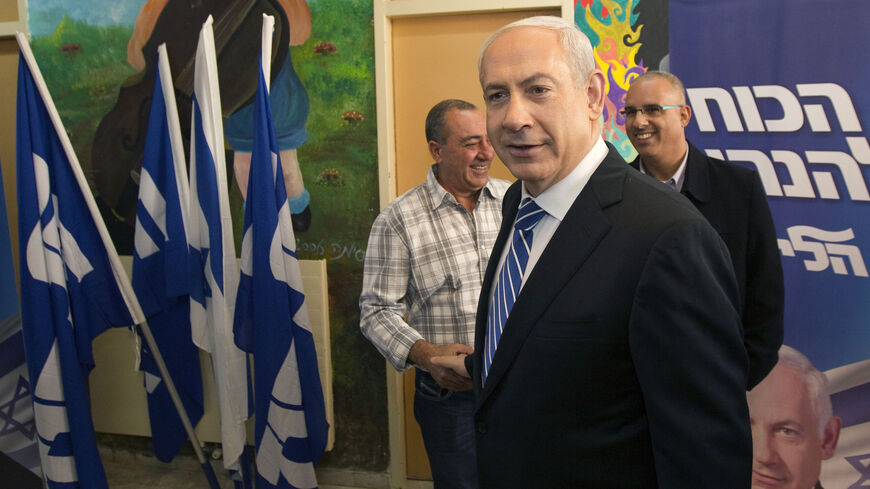 Israel's Prime Minister Benjamin Netanyahu (C) leaves after casting his ballot for the Likud party leadership election at a polling station in the West Bank Jewish settlement of Givat Zeev, near Jerusalem November 25, 2012. REUTERS/Ronen Zvulun (WEST BANK - Tags: POLITICS ELECTIONS) - RTR3AUN8
