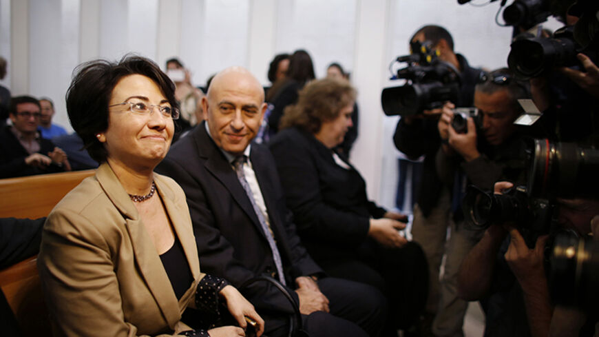 Israeli Arab lawmaker Haneen Zoabi (L) waits before a hearing at the Supreme Court in Jerusalem December 27, 2012. Zoabi appealed to the Supreme Court after Israel's electoral authority barred her from re-election on December 19, saying she had supported the nation's enemies by joining a protest ship that tried to break a naval blockade of Gaza. REUTERS/Ammar Awad (JERUSALEM - Tags: POLITICS) - RTR3BXBA