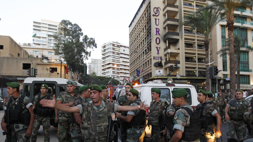 Lebanese army soldiers secure the area near Duroy hotel following a bomb attack in Raouche, in western Beirut June 25, 2014. A suicide bomber killed himself and wounded several security officers at the hotel in Beirut close to the Saudi Arabian embassy on Wednesday, Lebanese security sources said. REUTERS/Mohamed Azakir  (LEBANON - Tags: POLITICS CIVIL UNREST MILITARY) - RTR3VQDL