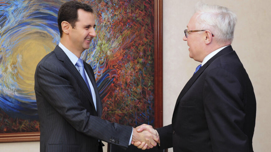 Syria's President Bashar al-Assad (L) shakes hands with Russia's Deputy Foreign Minister Sergei Ryabkov before a meeting in Damascus in this June 28, 2014 picture released by Syria's national news agency SANA. REUTERS/SANA/Handout via Reuters (SYRIA - Tags: POLITICS) 

ATTENTION EDITORS - THIS PICTURE WAS PROVIDED BY A THIRD PARTY. REUTERS IS UNABLE TO INDEPENDENTLY VERIFY THE AUTHENTICITY, CONTENT, LOCATION OR DATE OF THIS IMAGE. FOR EDITORIAL USE ONLY. NOT FOR SALE FOR MARKETING OR ADVERTISING CAMPAIGNS. 