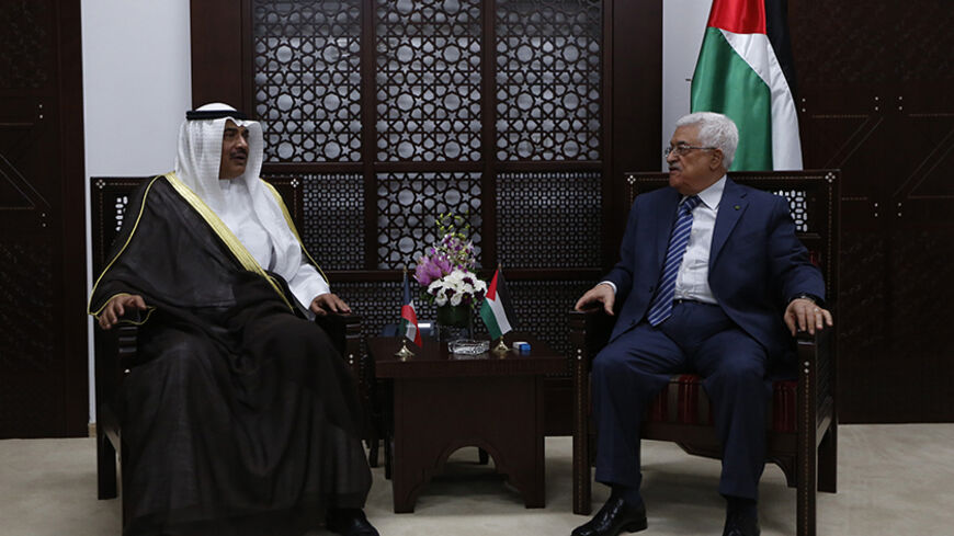 Palestinian President Mahmoud Abbas (R) meets Kuwait's Minister of Foreign Affairs Sheikh Sabah al Khalid al Sabah, in the West Bank city of Ramallah September 14, 2014.  REUTERS/Mohamad Torokman (WEST BANK - Tags: POLITICS) - RTR465AY