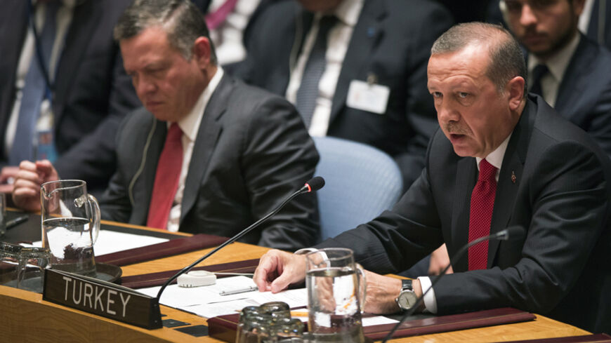 Turkey's President Tayyip Erdogan (R) speaks during the U.N. Security Council meeting in New York September 24, 2014. Seen on the left is Jordan's King Abdullah. REUTERS/Adrees Latif (UNITED STATES - Tags: POLITICS) - RTR47L12