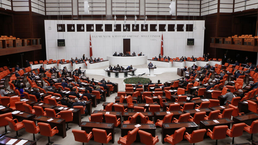 Turkish Parliament convenes to vote on a motion which would allow the government to authorise cross-border military incursions against Islamic State fighters in Syria and Iraq, and allow coalition forces to use Turkish territory, in Ankara October 2, 2014. REUTERS/Umit Bektas (TURKEY - Tags: POLITICS MILITARY CIVIL UNREST CONFLICT) - RTR48OUH