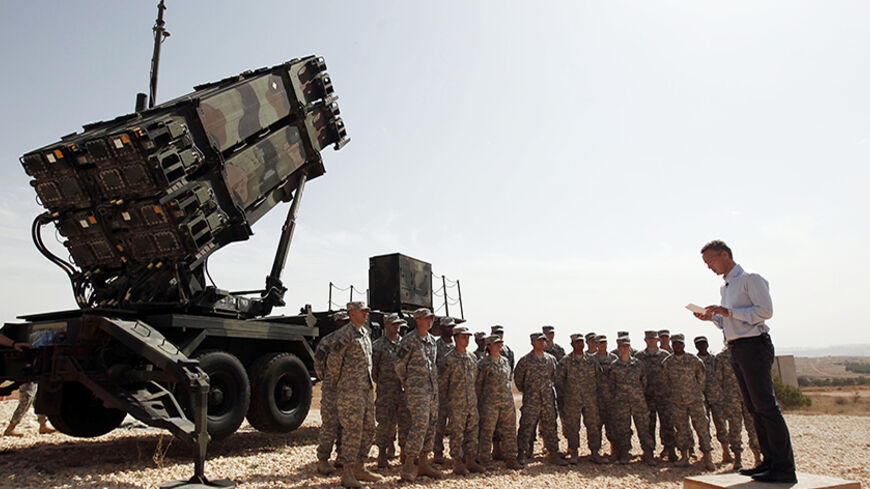 NATO Secretary-General Jens Stoltenberg of Norway addresses U.S. soldiers during his visit to view the U.S. Patriot missile system at a Turkish military base in Gaziantep, southeastern Turkey, October 10, 2014. REUTERS/Osman Orsal (TURKEY - Tags: POLITICS MILITARY TPX IMAGES OF THE DAY CONFLICT) - RTR49NVP