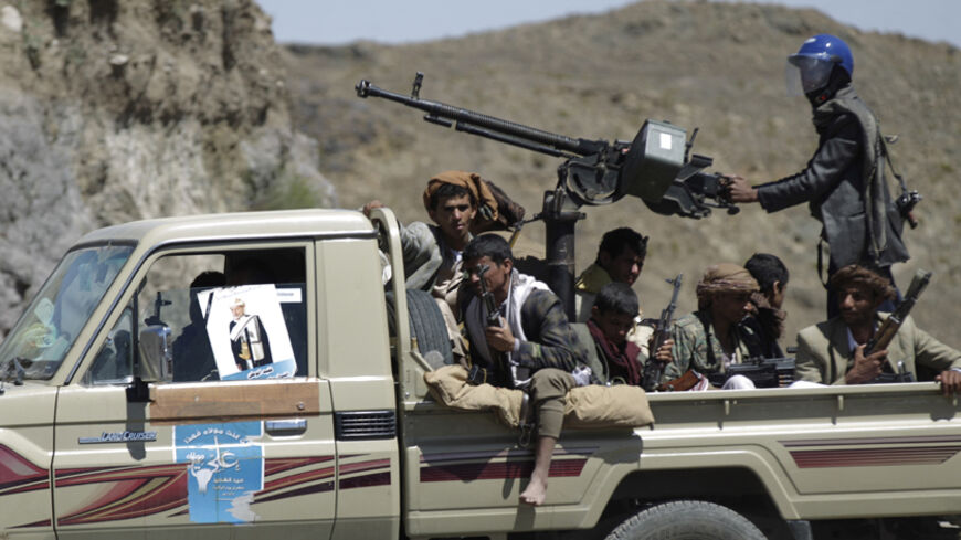 Shi'ite Houthi rebels ride a patrol truck in Yareem town of Yemen's central province of Ibb October 22, 2014. Houthi fighters clashed with supporters of the Sunni Muslim Islah party in Yareem, earlier this week, residents and local officials said, raising the spectre of a wider sectarian confrontation in the country, which shares a long border with the world's top oil exporter, Saudi Arabia. REUTERS/Khaled Abdullah (YEMEN - Tags: POLITICS CIVIL UNREST) - RTR4B6F7