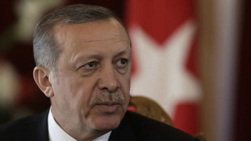 Turkey's President Recep Tayyip Erdogan listens during a news conference in Riga October 23, 2014. REUTERS/Ints Kalnins (LATVIA - Tags: POLITICS HEADSHOT) - RTR4BAGC