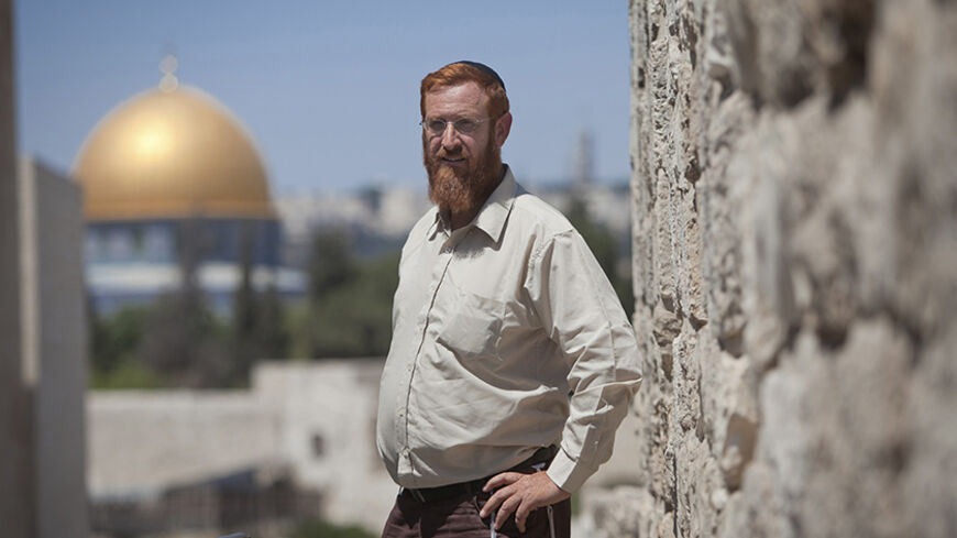 Yehuda Glick, an activist of the "temple mount faithful" group, poses for a photo in Jerusalem June 30, 2011. Glick was shot and severely wounded in Jerusalem on October 29, 2014 as he left a conference promoting a Jewish campaign to permit praying at a compound in the Old City that that has become a flashpoint as both Jews and Muslims regard it as a holy site, Israeli officials said. Israeli police shot dead a Palestinian on Thursday after he fired at them resisting arrest in East Jerusalem hours after the