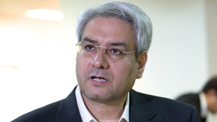 Iranian reformist Ebrahim Asgharzadeh prepares his paperwork to register as a presidential candidate at the Interior Ministry in Tehran.  Iranian reformist Ebrahim Asgharzadeh prepares his paperwork to register as a presidential candidate at the Interior Ministry in Tehran May 14,2005. Candidates began registering on May 10 for Iran's June 17 presidential election. REUTERS/Raheb Homavandi - RTRB4PM