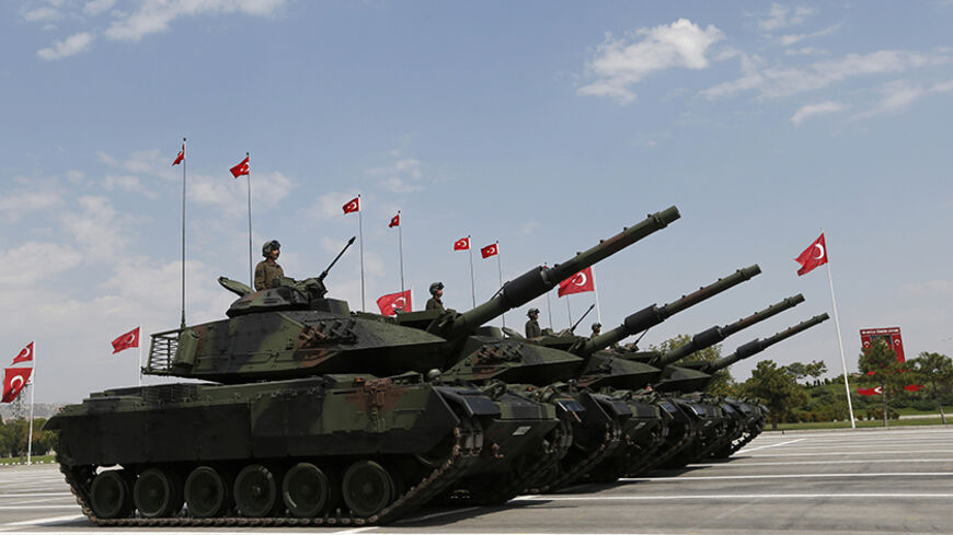 Turkish army tanks and aircrafts take part in a parade marking the 91st anniversary of Victory Day in Ankara August 30, 2013. REUTERS/Umit Bektas (TURKEY - Tags: POLITICS MILITARY ANNIVERSARY) - RTX131DZ