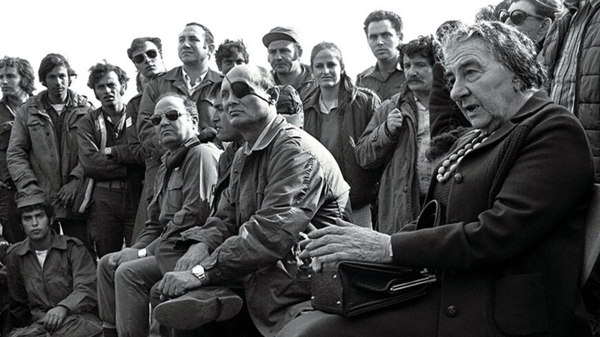 - FILE PHOTO 21NOV73 - Prime Minister Golda Meir (R) accompanied by her Defense Minister Moshe Dayan, meets with Israeli soldiers at a base on the Golan Heights after intense fighting during the 1973 Yom Kippur War.[ Israel was simultaneously attacked by Syria and Egypt on Yom Kippur, the Jewish Day of Atonement when all of Israel comes to a standstill, and was only able to defeat both countries when the United States provided an emergency major resupply of equipment. Israel suffered heavy causalities and m