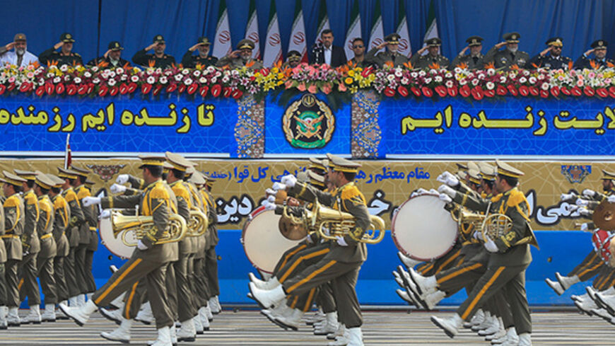 Iranian President Mahmoud Ahmadinejad (C) attends National Army Day parade in Tehran April 18, 2013. REUTERS/Hamid Forootan/ISNA/Handout (IRAN - Tags: MILITARY ANNIVERSARY) ATTENTION EDITORS - THIS PICTURE WAS PROVIDED BY A THIRD PARTY. REUTERS IS UNABLE TO INDEPENDENTLY VERIFY THE AUTHENTICITY, CONTENT, LOCATION OR DATE OF THIS IMAGE. THIS PICTURE IS DISTRIBUTED EXACTLY AS RECEIVED BY REUTERS, AS A SERVICE TO CLIENTS. FOR EDITORIAL USE ONLY. NOT FOR SALE FOR MARKETING OR ADVERTISING CAMPAIGNS - RTXYQFH