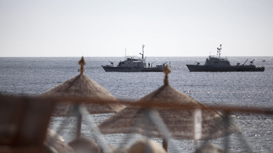 Egyptian navy vessels patrol off the coast of the Red Sea resort city of Sharm el-Sheikh on February 17, 2011. Tourists have started trickling back to Egypt's balmy Red Sea coast in the wake of its national uprising, but ghost-town resorts are still reeling from crises that preceded the unrest. AFP PHOTO/MARCO LONGARI (Photo credit should read MARCO LONGARI/AFP/Getty Images)