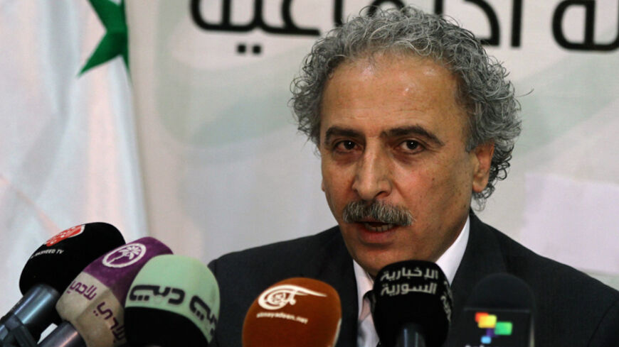 Louay Hussein, a Syrian leading intellectual and the leader of the Syrian opposition movement of "Building the Syrian State Movement" addresses a press conference in Damascus on July 12, 2012. AFP PHOTO\LOUAI BESHARA        (Photo credit should read LOUAI BESHARA/AFP/GettyImages)