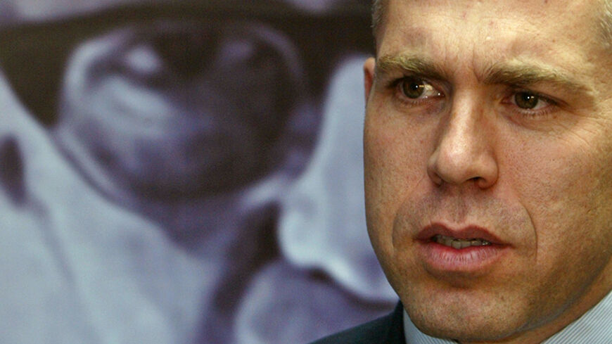 Israeli parliament member Gilad Erdan attends a news conference in Tel Aviv January 19, 2006. Erdan, a member of the Likud party who is chairman of the Israeli parliament's sports subcommittee, has written to German Chancellor Angela Merkel, urging her to prevent Iran from taking part in the soccer World Cup unless it retracts inflammatory statements about Israel and the Holocaust. REUTERS/Gil Cohen Magen - RTR18GH1