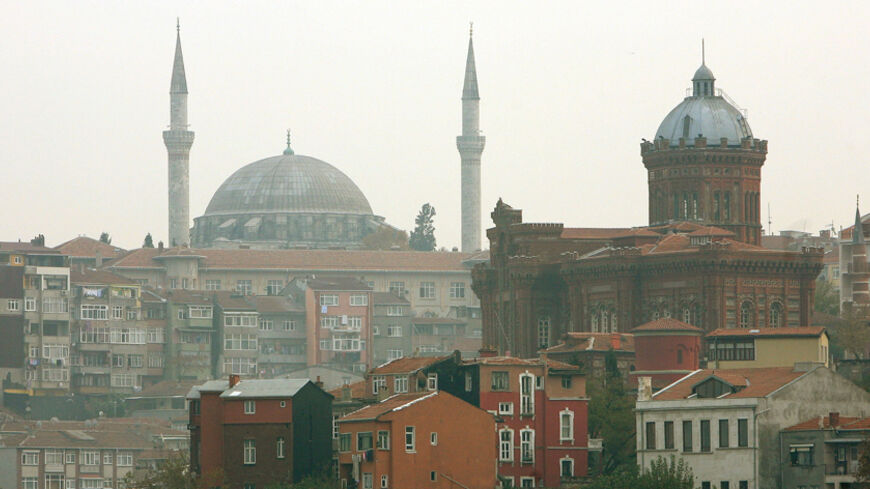 The Fener Greek highschool with the Mosque of Yavuz Selim in the background overlooks the Fener district in Golden Horn where the Greek Orthodox Patriarchate complex is located in Istanbul November 21, 2006. Pope Benedict will pay an official visit to Muslim but secular Turkey on November 28 to December 1 and will hold talks with Patriarch Bartholomew, spiritual head of the world's Orthodox Christians, at the Patriarch's residence in Istanbul. REUTERS/Fatih Saribas (TURKEY) - RTR1JKES