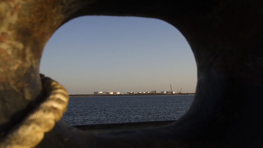 EDITORS' NOTE: Reuters and other foreign media are subject to Iranian restrictions on leaving the office to report, film or take pictures in Tehran.

A general view of an oil dock is seen from a ship at the port of Kalantari in the city of Chabahar, 300km (186 miles) east of the Strait of Hormuz January 17, 2012. REUTERS/Raheb Homavandi  (IRAN - Tags: SOCIETY) - RTR2WFMH