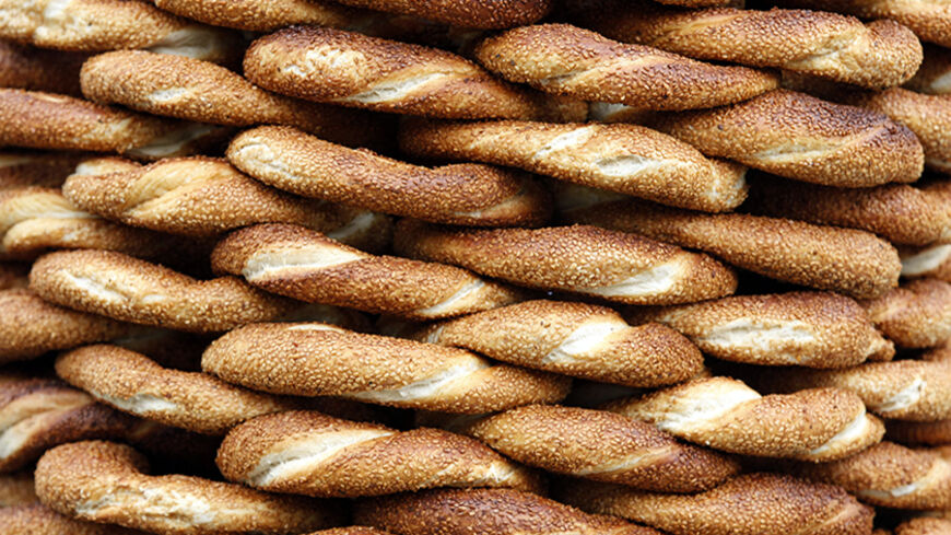A pile of simit, the traditional Turkish sesamed bread, is displayed for sale in Istanbul February 17, 2012.  REUTERS/Murad Sezer (TURKEY  - Tags: FOOD) - RTR2Y0AG