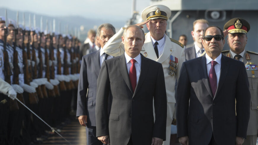 Russia's President Vladimir Putin (2nd R) and his Egyptian counterpart Abdel Fattah al-Sisi (R) attend a welcoming ceremony onboard guided missile cruiser Moskva at the Black Sea port of Sochi, August 12, 2014.  REUTERS/Alexei Druzhinin/RIA Novosti/Kremlin (RUSSIA  - Tags: POLITICS MILITARY) ATTENTION EDITORS - THIS IMAGE HAS BEEN SUPPLIED BY A THIRD PARTY. IT IS DISTRIBUTED, EXACTLY AS RECEIVED BY REUTERS, AS A SERVICE TO CLIENTS - RTR4260Q