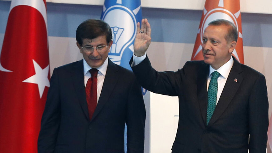 Turkey's President-elect Tayyip Erdogan (R) and incoming prime minister Ahmet Davutoglu leave the stage together during the Extraordinary Congress of the ruling AK Party (AKP) in Ankara August 27, 2014. Erdogan said on Wednesday he would ask Davutoglu to form a new government on Thursday, and a new cabinet of ministers would be announced the following day. REUTERS/Umit Bektas (TURKEY - Tags: POLITICS) - RTR43Z11