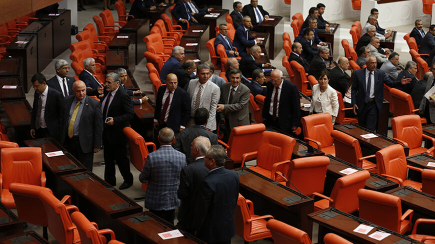 Members of parliament from Turkey's main opposition Republican People's Party (CHP) walk out during the inauguration ceremony of new President Tayyip Erdogan (not pictured) at the parliament in Ankara August 28, 2014. Erdogan was sworn in as Turkey's 12th president on Thursday, cementing his position as its most powerful leader of recent times, in what his opponents fear heralds an increasingly authoritarian rule. Reading the oath of office in a ceremony in parliament, Erdogan vowed to protect Turkey's inde