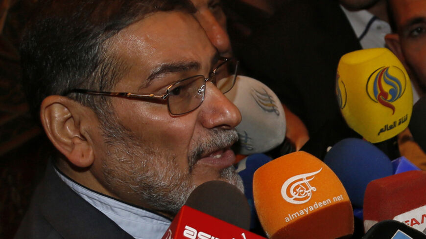 Admiral Ali Shamkhani, Iran?s Supreme National Security Council Director, speaks to the media after his arrival at Damascus airport, September 30, 2014. REUTERS/Khaled al-Hariri (SYRIA - Tags: POLITICS CONFLICT CIVIL UNREST) - RTR48C04