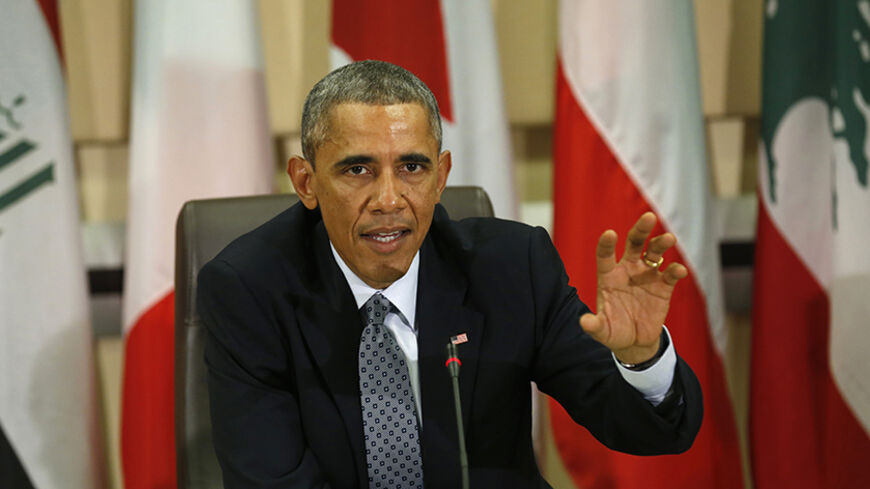 U.S. President Barack Obama speaks at a meeting with more than 20 foreign defense chiefs to discuss the coalition efforts in the ongoing campaign against ISIL at Joint Base Andrews in Washington October 14, 2014.  Some three weeks before U.S. congressional elections viewed largely as a referendum on Obama's leadership, the president will aim to show the U.S. public and allies abroad that he is committed to a plan to "degrade" and "destroy" the group that has taken over large swaths of Iraq and Syria.

 REUT