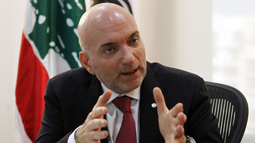 Lebanon's Economy and Trade Minister Alain Hakim speaks during an interview with Reuters in Beirut October 24, 2014. Lebanon's economy will grow by no more than 2 or 2.5 percent next year if it does not resolve its political problems as it struggles to cope with the fallout from the war in neighbouring Syria, Hakim said. Picture taken October 24.   REUTERS/Mohamed Azakir   (LEBANON - Tags: POLITICS BUSINESS CONFLICT) - RTR4BKBT