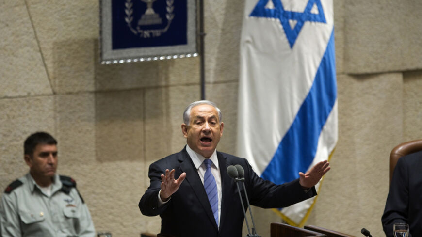 Israel's Prime Minister Benjamin Netanyahu speaks at the opening of the winter session of the Knesset, the Israeli parliament, in Jerusalem October 27, 2014. Netanyahu will expedite planning for some 1,000 settler homes in East Jerusalem, a government official said on Monday, in a bid to placate a restive coalition ally without further aggravating a dispute with Washington. REUTERS/Ronen Zvulun (JERUSALEM - Tags: POLITICS) - RTR4BSDI