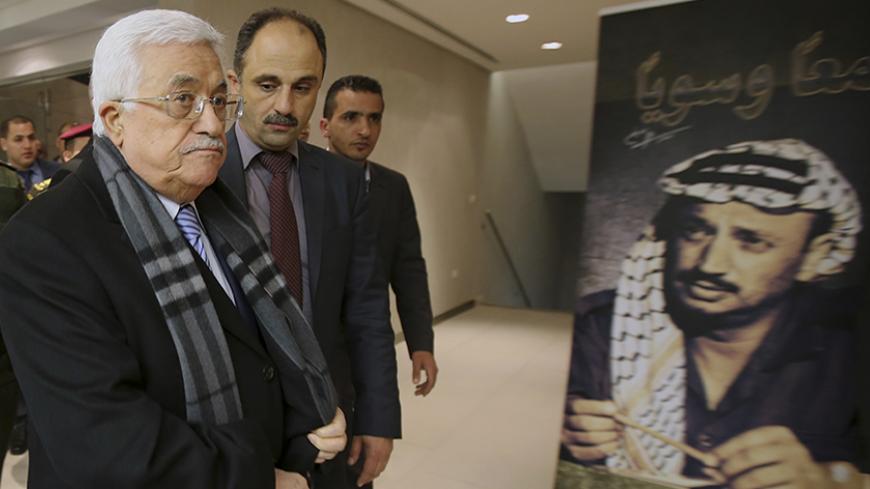 Palestinian President Mahmoud Abbas (C) arrives for the opening of a museum of late Palestinian leader Yasser Arafat in the West Bank city of Ramallah, November 9, 2014. REUTERS/Abbas Momani/Pool (WEST BANK - Tags: POLITICS SOCIETY) - RTR4DGQA