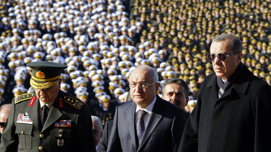 Turkish President Tayyip Erdogan (R), Speaker of the Turkish parliament Cemil Cicek and Chief of Staff General Necdet Ozel (L) attend a ceremony at the mausoleum of Mustafa Kemal Ataturk, marking the anniversary of his death, in Ankara November 10, 2014. Thousands of Turks visited Ataturk's mausoleum on his 76th death anniversary. Ataturk, the first president of Turkey from 1923 and founder of the modern secular state, died on November 10, 1938. He was 57. REUTERS/Umit Bektas (TURKEY - Tags: POLITICS ANNIVE