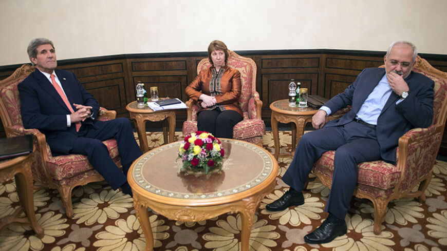 U.S. Secretary of State John Kerry (L), EU envoy Catherine Ashton (C) and Iranian Foreign Minister Mohammad Javad Zarif meet in Muscat November 10, 2014. Iran, the United States and the European Union began an unscheduled second day of talks on Monday over disagreements blocking the resolution of a confrontation over Tehran's nuclear program, U.S. and Iranian officials said. REUTERS/Nicholas Kamm/Pool (OMAN - Tags: POLITICS TPX IMAGES OF THE DAY) - RTR4DL5G