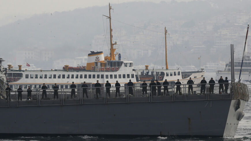 U.S. sailors stand on board as guided-missile destroyer USS Ross leaves from the port in Istanbul November 13, 2014. A group of Turkish ultra-nationalists attacked three U.S. sailors on a crowded street in Istanbul on Wednesday, shouting "Yankee go home" and trying to pull hoods over their heads in an assault condemned by the United States. The attackers' actions were an apparent reference to an incident in Iraq in July 2003, when U.S. forces detained a Turkish special forces unit, leading its members away 
