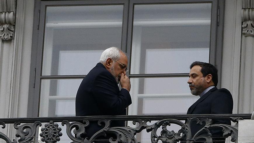 Iranian Foreign Minister Javad Zarif (L) and Abbas Araghchi, Iran's chief nuclear negotiator, stand on the balcony of Palais Coburg during a meeting between Iran and six world powers in Vienna November 22, 2014. Iran, the United States, Britain, France, Germany, Russia and China began the final round of negotiations on a nuclear deal on Tuesday. Officials close to the talks have said the two sides are unlikely to secure a final agreement and may need to extend the negotiations.      REUTERS/Leonhard Foeger 