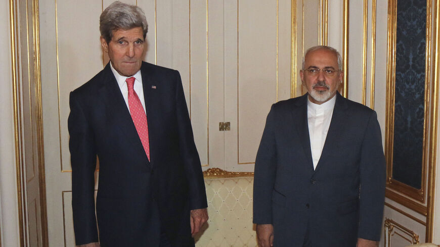 U.S. Secretary of State John Kerry (L) and Iranian Foreign Minister Javad Zarif (R) are pictured before a meeting in Vienna November 23, 2014. Iran, the United States and other world powers are all but certain to miss Monday's deadline for negotiations to resolve a 12-year stand-off over Tehran's atomic ambitions, forcing them to seek an extension, sources say. The talks in Vienna could lead to a transformation of the Middle East, open the door to ending economic sanctions on Iran and start to bring a natio