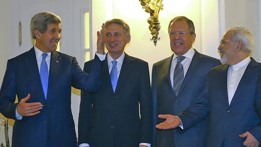U.S. Secretary of State John Kerry, Britain's Foreign Secretary Philip Hammond, Russian Foreign Minister Sergei Lavrov and Iranian Foreign Minister Javad Zarif (LtoR) pose for photographers before a meeting in Vienna November 24, 2014. Iran, the United States and other world powers are all but certain to miss Monday's deadline for negotiations to resolve a 12-year stand-off over Tehran's atomic ambitions, forcing them to seek an extension, sources say. The talks in Vienna could lead to a transformation of t