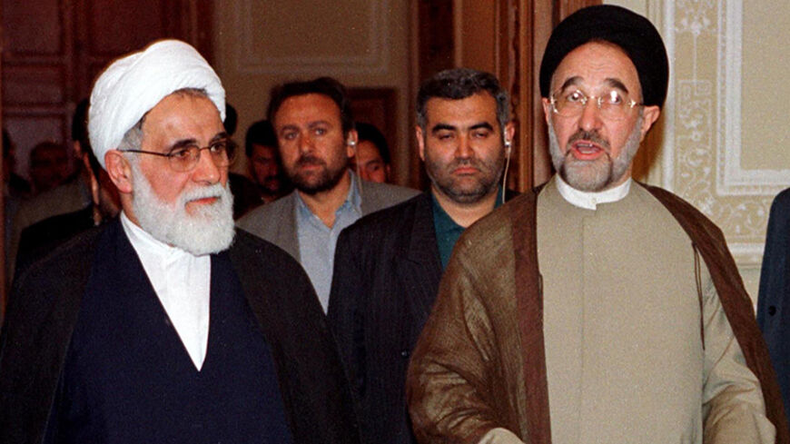 Iranian President Mohammad Khatami (R) accompanied by Speak of Parliament Ali Akbar Nateq-Nouri (L) reacts upon entering the newly refurbished old parliament building in Tehran's Baharestan Square May 22. Khatami said Iran was the first country in the Middle East region to experience popular democracy.

cjf - RTR4KFE