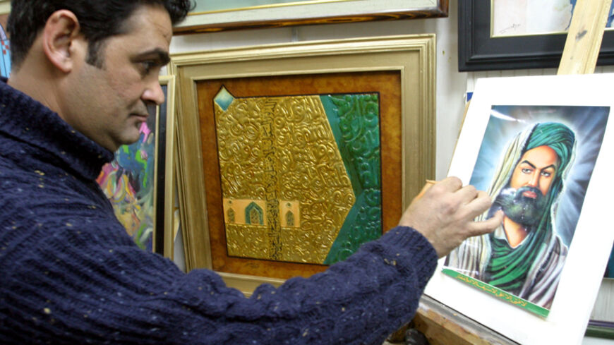 Iraqi artist Wissam Ghadi paints a portrait of Shi'ite Imam Ali in his Al Sadr city studio on the outkirts of Baghdad December 25, 2003. Repressed under three decades of secular Arab nationalist rule, Iraq's majority Shi'ite Muslims are enjoying the new-found freedom of painting religious figures to practice their faith with impunity. Picture taken December 25, 2003. TO MOVE WITH FEATURE STORY BC-IRAQ-SHI'ITES-PAINTING REUTERS/Ali Jasim  CLH/AA - RTR9AJE