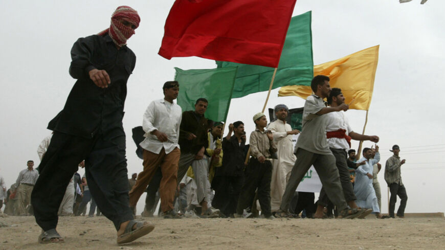 An Iraqi man joins other pilgrims on the way to Karbala (100km south of
Baghdad) April 19, 2003, to celebrate the Shi'ite Ashoura. The traditional
pilgrimage has been banned in Iraq for more than 30 years. PP03040058
REUTERS/Petr Josek

PJ/GB - RTRM2R2