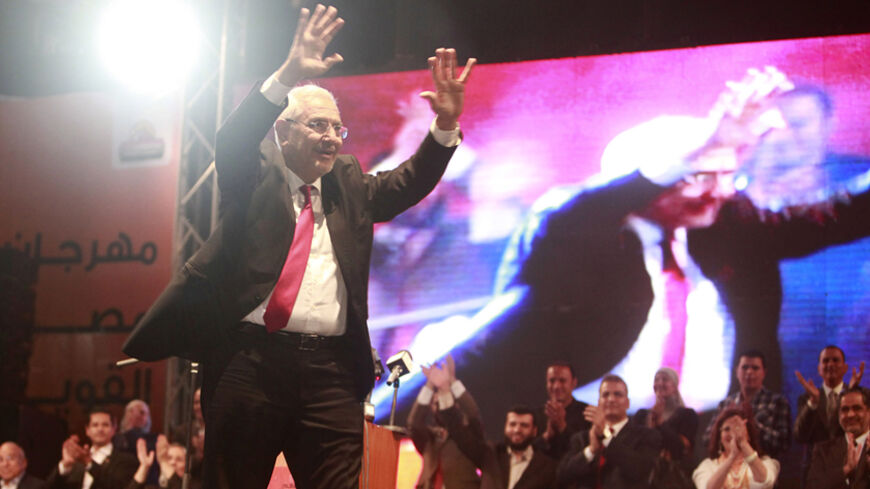 Presidential candidate Abdel Moneim Aboul Fotouh greets his supporters during a presidential rally in Cairo May 18, 2012. The elections will take place on May 23-24. REUTERS/Asmaa Waguih (EGYPT - Tags: POLITICS ELECTIONS) - RTR329LC