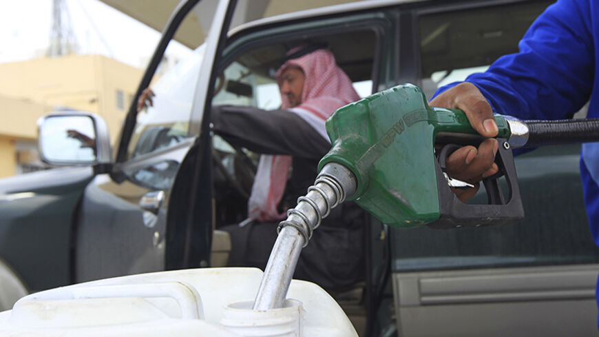An employee fills a container with diesel at a gas station in Riyadh December 19, 2012. Saudi Arabia could as early as next year do something it has resisted for decades: raise what is currently the world's lowest price for natural gas, in order to reduce expensive subsidies and curb energy waste. A price hike would be an important economic shift for the country but a difficult one, as it would risk hurting the competitiveness of industries such as petrochemicals. To match Analysis SAUDI-GAS/PRICE REUTERS/F