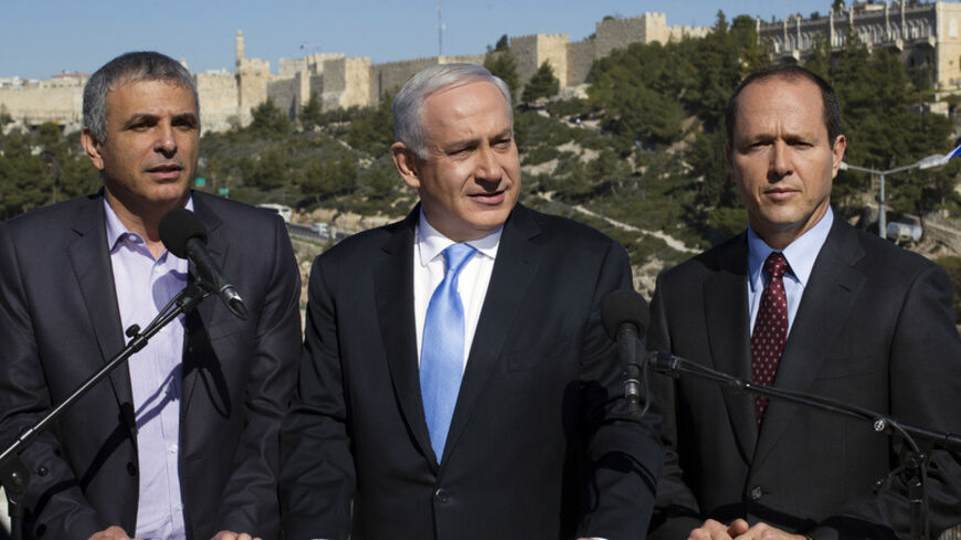 Israel's Prime Minister Benjamin Netanyahu (C) stands with Jerusalem Mayor Nir Barkat (R) and Communications Minister Moshe Kahlon outside the Menachem Begin Heritage Center in Jerusalem January 21, 2013. Netanyahu made an election eve appeal to wavering supporters to "come home", showing concern over a forecast far-right surge that would keep him in power but weaken him politically. REUTERS/Baz Ratner (JERUSALEM - Tags: POLITICS ELECTIONS) - RTR3CQJQ