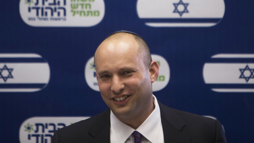 Naftali Bennett (C), smiles during a Jewish Home party meeting, at the Knesset, the Israeli parliament, in Jerusalem March 4, 2013. A surprise alliance between Israeli political stars, far-right Bennett, and centrist Yair Lapid, who reject privileges for ultra-orthodox Jews is frustrating Prime Minister Benjamin Netanyahu's efforts to form a new government. REUTERS/Ronen Zvulun (JERUSALEM - Tags: POLITICS) - RTR3EKA2