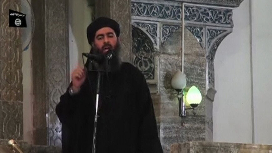 A man purported to be the reclusive leader of the militant Islamic State Abu Bakr al-Baghdadi has made what would be his first public appearance at a mosque in the centre of Iraq's second city, Mosul, according to a video recording posted on the Internet on July 5, 2014, in this still image taken from video. There had previously been reports on social media that Abu Bakr al-Baghdadi would make his first public appearance since his Islamic State in Iraq and the Levant (ISIL) changed its name to the Islamic S