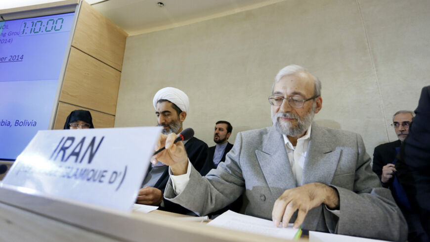 Mohammad Javad Larijani (front, on R), secretary of Iran's High Council for Human Rights and advisor to the chief of the judiciary on international affairs, who is leading Iran's delegation, sits during the United Nations (U.N.) Human Rights Council's Universal Periodic Review (UPR) Working Group meeting to review Iran's human rights record, at the (U.N.) European headquarters in Geneva October 31, 2014. REUTERS/Pierre Albouy (SWITZERLAND - Tags: POLITICS) - RTR4CA9W