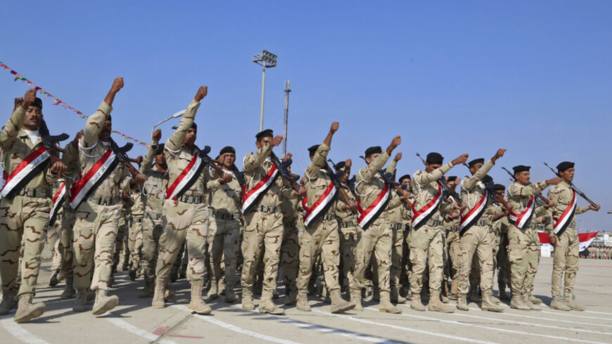 Iraqi soldiers march during a graduation ceremony in Baghdad November 18, 2014.REUTERS/Stringer (IRAQ - Tags: MILITARY) - RTR4EN87